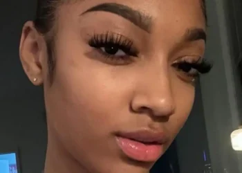 INCOMING: Angel Reese Stuns In Red Eyeglasses In New Busty Selfies