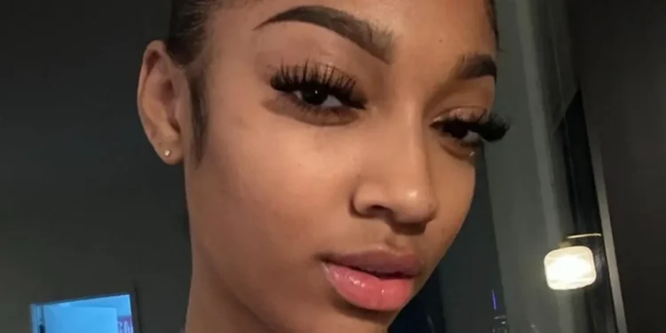 INCOMING: Angel Reese Stuns In Red Eyeglasses In New Busty Selfies