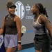 Coco Gauff assists an injured Naomi Osaka in walking off the court after she is forced to forfeit the game due to back problems.