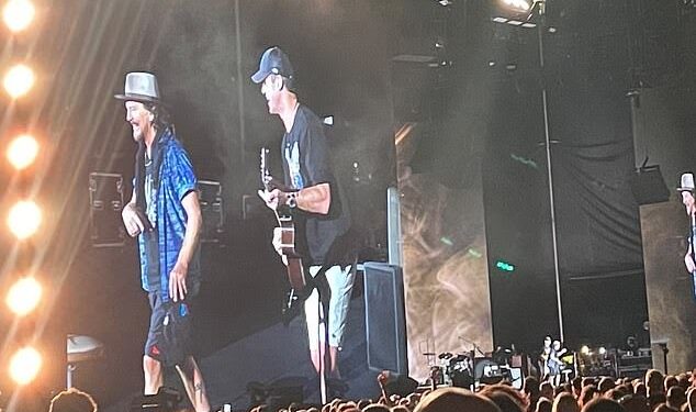 During a Melbourne event, Pearl Jam frontman Eddie Vedder invites an Australian Football League icon on stage.