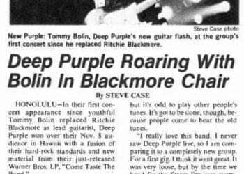 Deep purple roaring, with bolin on a black chair.