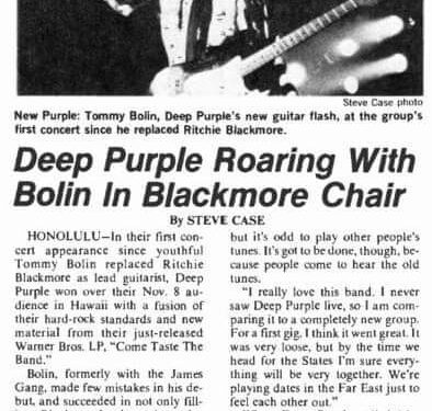Deep purple roaring, with bolin on a black chair.