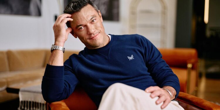 Luke Evans, an unlikely action star, has relived his history to inspire others.