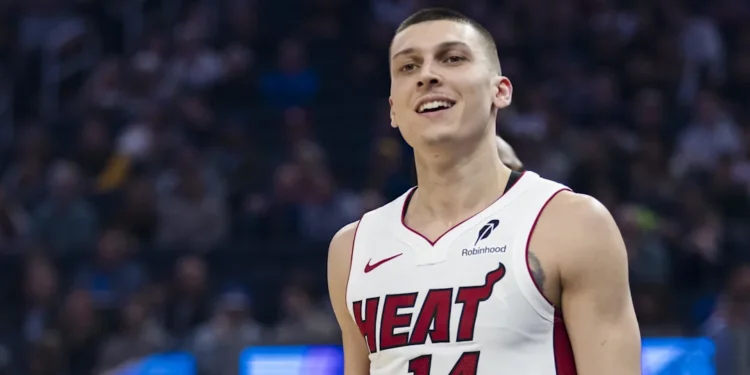 Basketball WAG Katya Elise Henry celebrates Tyler Herro’s birthday in a sheer black top.